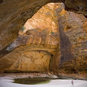 Cave in waterfall undercut, Cathedral Gorge in Purnululu National Park (Bungle Bungle), UNESCO World Heritage Site, Western Australia, Australia, Pacific
