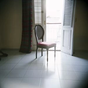 Chair in front of window, Hotel La Union, Cienfuegos, Cuba, West Indies, Central America