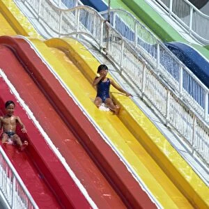 Children on the water chute of the Big Splash Aquatic Disneyland
