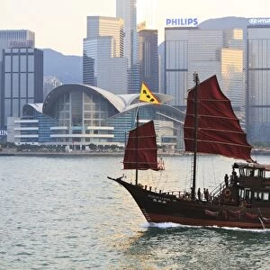 Chinese junk boat sails on Victoria Harbour, Hong Kong, China, Asia