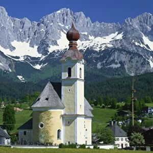 Church with onion dome at Going, with mountains behind, in the Tirol, Austria, Europe