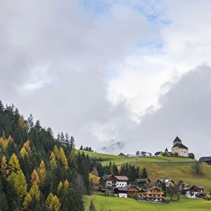 Ciastel de Tor surrounded by woods in autumn, San Martino in Badia, Val Badia, Dolomites