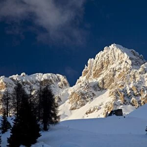 Cima dell Uomo snow peak at sunset, San Pellegrino pass, Dolomites