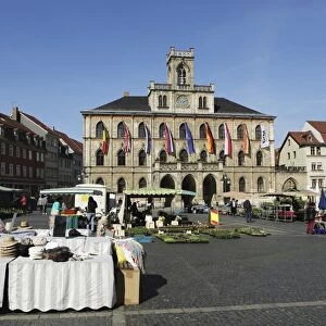 The City Hall (Rathaus) and market stalls on the cobbled Market Place (Marktplatz) in Weimar