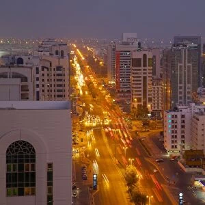 City skyline and Rashid Bin Saeed Al Maktoum Street at dusk, Abu Dhabi, United Arab Emirates, Middle East