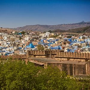 The city wall of Mehrangarh Fort towering over the blue rooftops in Jodhpur, the Blue City