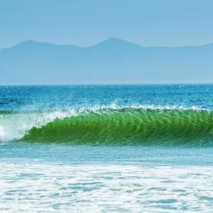 Classic curling shore break surf wave, typical of this coast, Playa Hermosa, San Juan del Sur, Rivas Province, Nicaragua, Central America