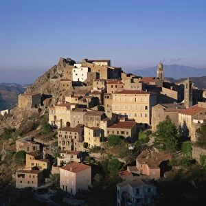Clifftop village of Speloncato, in dusk light, Balagne region, Corsica, France, Europe