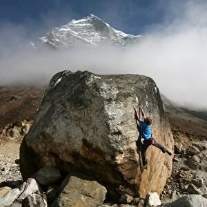 A climber tackles a difficult boulder problem on the glacial moraine at Tangnag