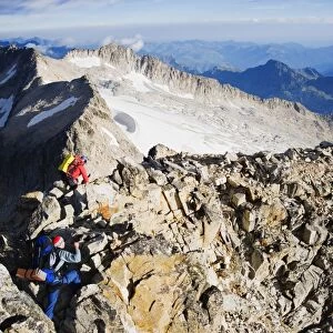 Climbers on summit of Pico de Aneto, at 3404m the highest peak in the Pyrenees
