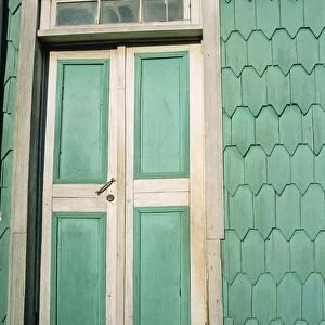 Close-up of door and house shingles (tejuelas), in zone of Dalcahue near Castro on the island of Chiloe, Chile