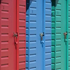 Close-up of multicoloured beach huts on the long sweeping beach of Llanbedrog
