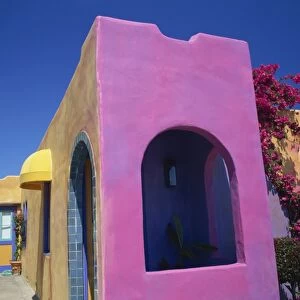 Close-up of pink wall of a colourful house at Pacific