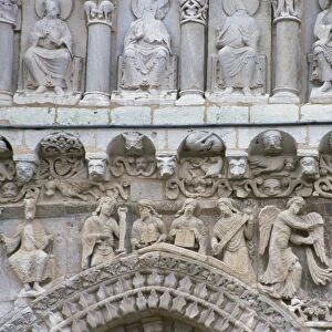 Close-up of sculptures including beasts and angels on the West Front of Eglise Notre Dame la Grande
