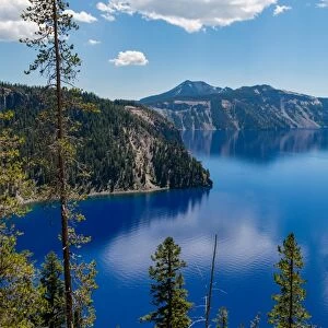 Cloud reflected in the still waters of Crater Lake, the deepest lake in the U. S. A