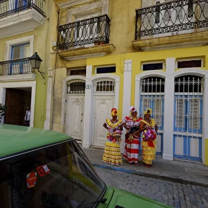 Three colorful ladies in traditional dress, Old Havana, Cuba, West Indies