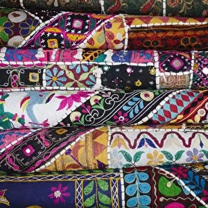Colourful hand woven fabrics at Mapusa Market, Goa, India, Asia