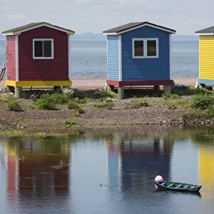 Colourfully painted huts by the shore of the Atlantic Ocean at Hearts Delight-Islington