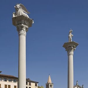 Two columns in the Piazza dei Signori, one bearing the Venice Lion, the other with St