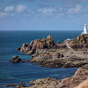 Corbiere Lighthouse and rocky coastline, Jersey, Channel Islands, United Kingdom, Europe