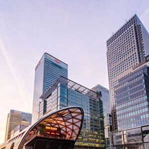 Crossrail station and office buildings reflecting in dock before sunrise, Canary Wharf, Docklands, London, England, United Kingdom, Europe