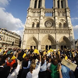 Crowds cheering Pope Benedict XVI outside Notre Dame cathedral, Paris, France, Europe