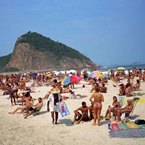 Crowds of people sunbathing on Copacabana Beach in Rio de Janeiro, Brazil, South America