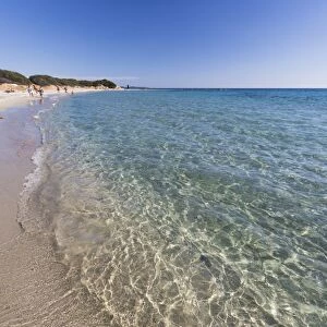 The crystal turquoise water of the sea frames the sandy beach, Sant Elmo Castiadas