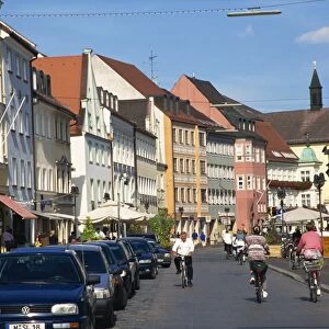 Cycling through town, Freising, Bavaria, Germany, Europe