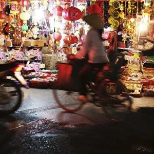 Cyclist in front of lantern stall, Hanoi, Vietnam, Indochina, Southeast Asia, Asia