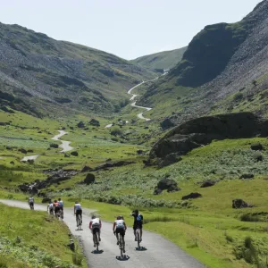 Cyclists ascending Honister Pass, Lake District National Park, Cumbria, England, United Kingdom, Europe