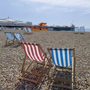 Deck chairs and pier, Brighton Beach, Brighton, Sussex, England, United Kingdom, Europe