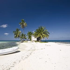 Dinghy on beach, Silk Caye, Belize, Central America