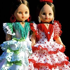 Two dolls dressed in Spanish costume