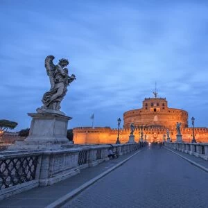 Dusk on the ancient palace of Castel Sant Angelo with statues of angels on the bridge