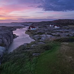 Dusk time on Ramsvik island with isolated houses on granite rocks facing the ocean, Bohuslan, Vastra Gotaland, West Sweden, Sweden, Scandinavia, Europe
