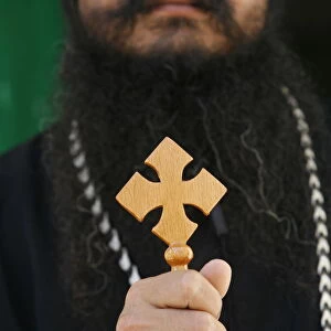 Egyptian Orthodox Coptic priest holding cross, Jerusalem, Israel, Middle East