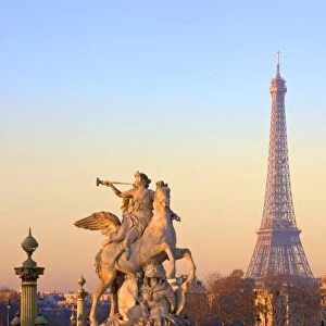 Eiffel Tower from Place de La Concorde with statue in foreground, Paris, France, Europe