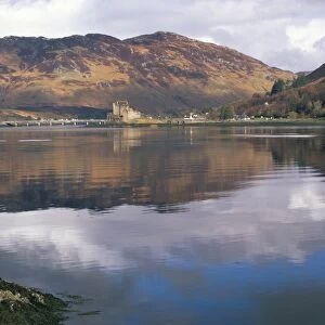 Eilean Donan castle reflected in calm water of Loch Duich from Totaig