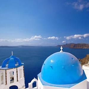 Elevated view of the Aegean Sea from a top of a church with blue domed roofs, Santorini