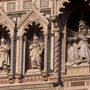Detail of the facade of polychrome marble of the Duomo