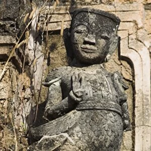 Figure carved in stucco decorates one of the ancient stupas, Kakku Buddhist Ruins