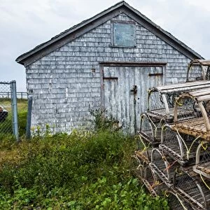 Fish traps in front of a shingle hut in Neils Harbour, Cape Breton Highlands National Park, Cape Breton Island, Nova Scotia, Canada, North America