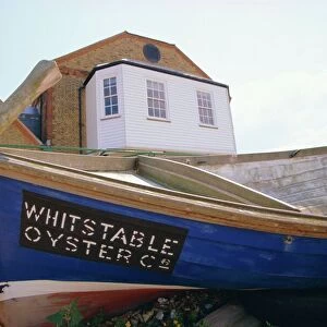 Fishing boat on the beach, Whitstable, Kent, England, UK. Whitstable is popular for its oyster