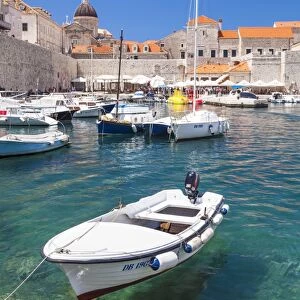 Fishing boat and clear water in the Old Port, Dubrovnik Old Town, Dubrovnik, Dalmatian Coast