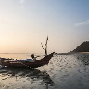Fishing boat on Maungmagan Beach at sunset, Dawei, Tanintharyi Region, Myanmar (Burma)