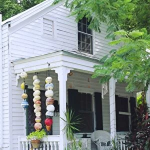 Fishing floats hanging in porch of old house in Key West