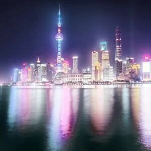 Foggy yet colorful skyline of Shanghai Pudong at night, Shanghai, China, Asia