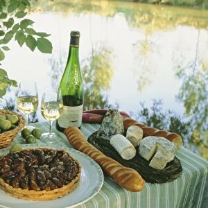 Food and wine on a table beside the river Loire, France, Europe