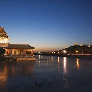 Forbidden City Palace Museum moat and Jingshan Park pavilions illuminated at night